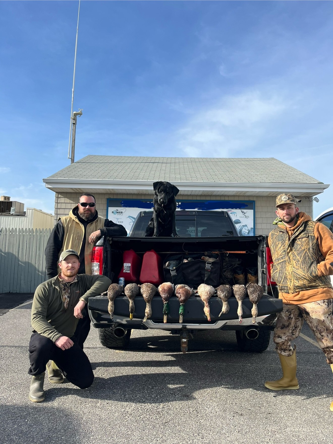 Black Bank Outfitters guides with duck limit at tailgate on Long Island