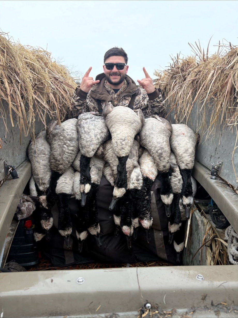 Brant limit beside a Long Island layout boat — Black Bank Outfitters waterfowl guide
